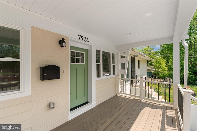 wooden deck featuring a porch