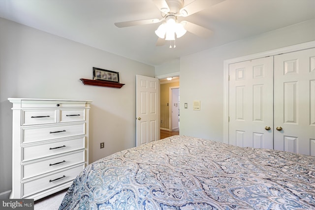 bedroom featuring ceiling fan and a closet