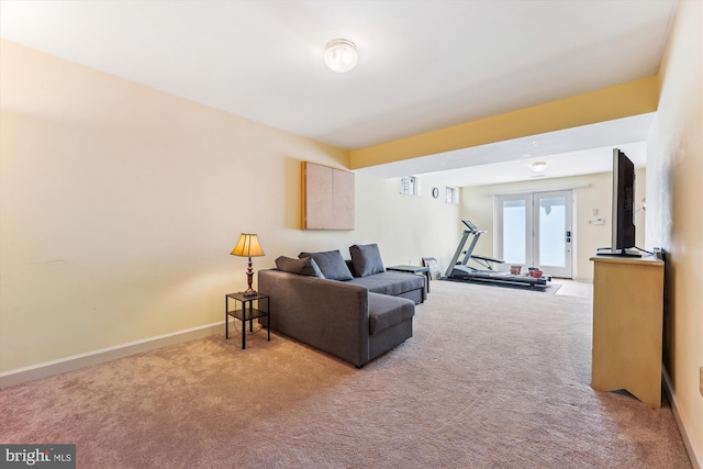living room with baseboards and carpet