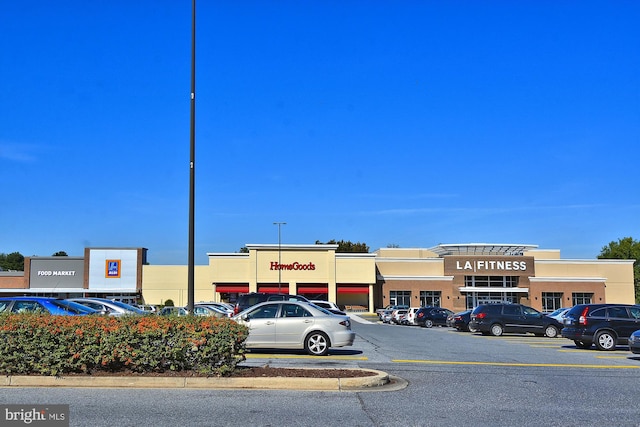 view of property with uncovered parking