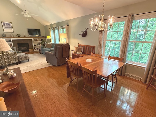 902 Hedgewyck Ln, Elizabethtown, PA 17022 - dining space featuring healthy amount of natural light, lofted ceiling, wood finished floors, a ceiling fan, and a chandelier