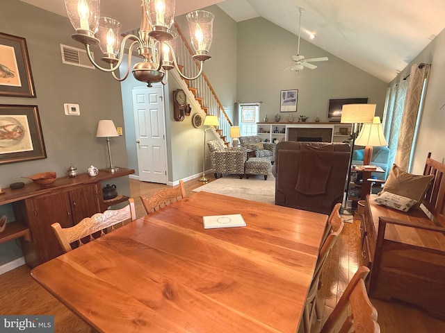902 Hedgewyck Ln, Elizabethtown, PA 17022 - dining area with ceiling fan, a chandelier, wood finished floors, high vaulted ceiling, and baseboards