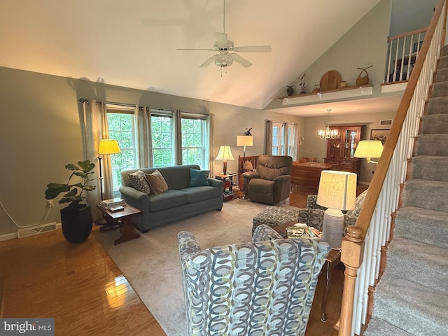 902 Hedgewyck Ln, Elizabethtown, PA 17022 - living room featuring stairs, ceiling fan, high vaulted ceiling, wood finished floors, and a chandelier