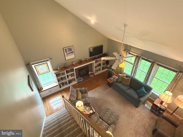 902 Hedgewyck Ln, Elizabethtown, PA 17022 - living room featuring wood finished floors, a fireplace, a ceiling fan, stairs, and baseboards