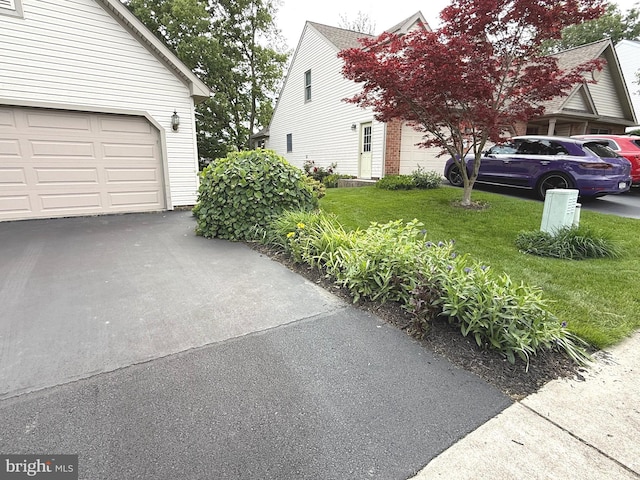 902 Hedgewyck Ln, Elizabethtown, PA 17022 - view of home's exterior with a garage, driveway, a lawn, and brick siding