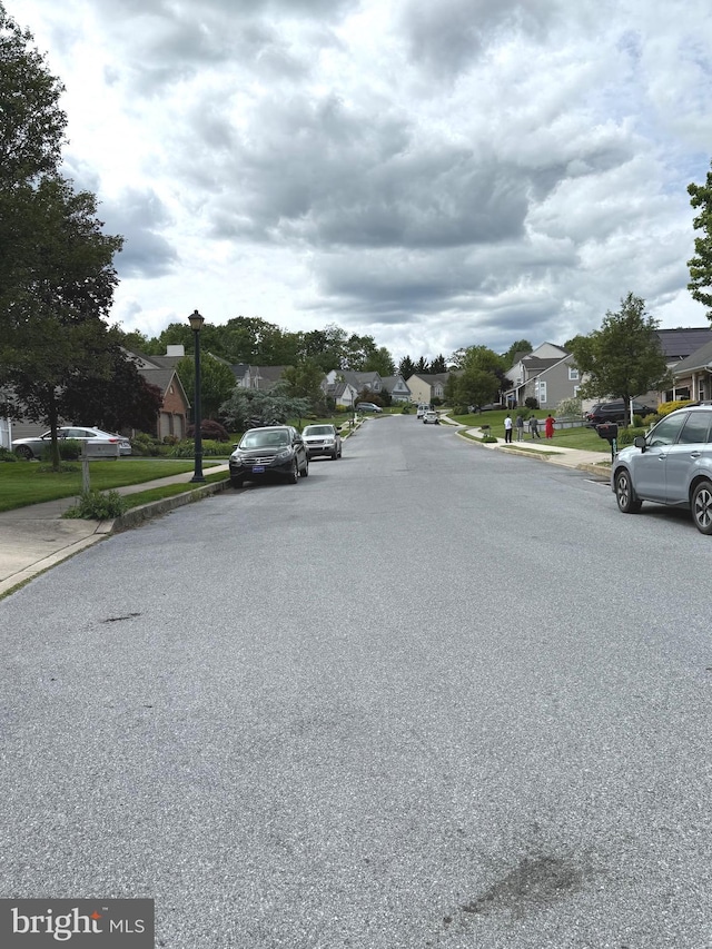 902 Hedgewyck Ln, Elizabethtown, PA 17022 - view of asphalt road featuring a residential view, sidewalks, curbs, and street lights