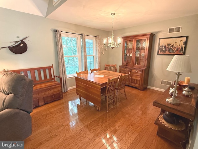 902 Hedgewyck Ln, Elizabethtown, PA 17022 - dining room with a chandelier, baseboards, and light wood finished floors