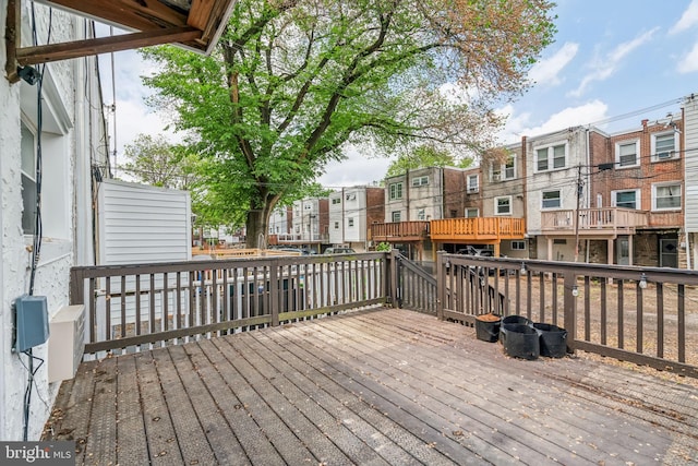 wooden deck featuring a residential view