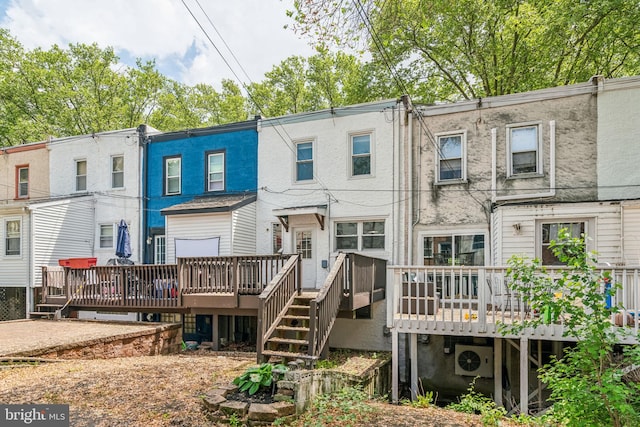 back of property featuring a wooden deck