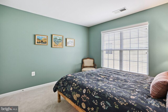 carpeted bedroom with baseboards