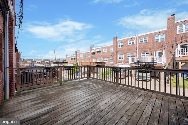 wooden deck with a residential view