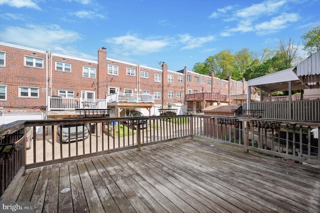 wooden terrace with a residential view