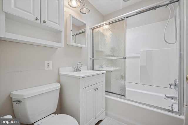full bath with vanity, enclosed tub / shower combo, and toilet