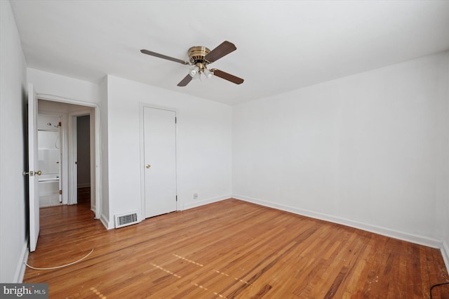 unfurnished bedroom with baseboards, ceiling fan, light wood finished floors, and visible vents