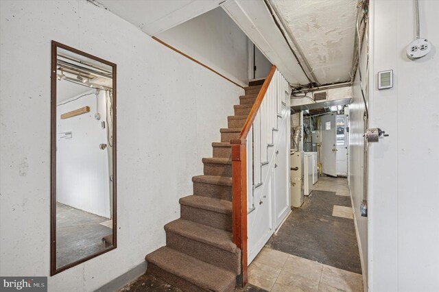 staircase with washer / dryer and visible vents