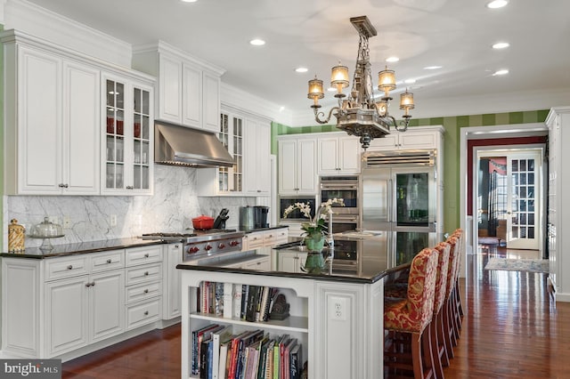 19326 Airwell Ct, Purcellville, VA 20132 - kitchen featuring under cabinet range hood, dark countertops, appliances with stainless steel finishes, and a sink
