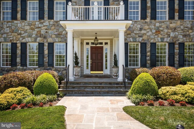 19326 Airwell Ct, Purcellville, VA 20132 - doorway to property with a balcony and stone siding