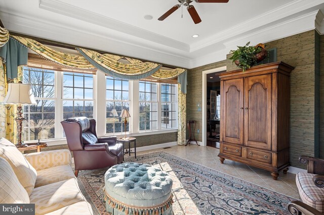 19326 Airwell Ct, Purcellville, VA 20132 - living area featuring crown molding, ceiling fan, baseboards, light tile patterned floors, and a tray ceiling