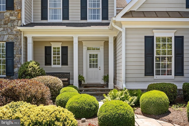 19326 Airwell Ct, Purcellville, VA 20132 - entrance to property featuring a standing seam roof, metal roof, and stone siding