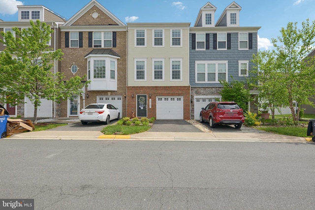 10723 Caledonia Meadow Dr, Manassas, VA 20112 - view of property featuring driveway, an attached garage, and brick siding