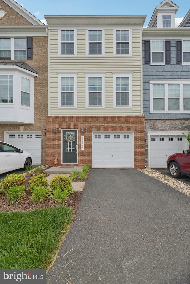 10723 Caledonia Meadow Dr, Manassas, VA 20112 - multi unit property featuring driveway and a garage