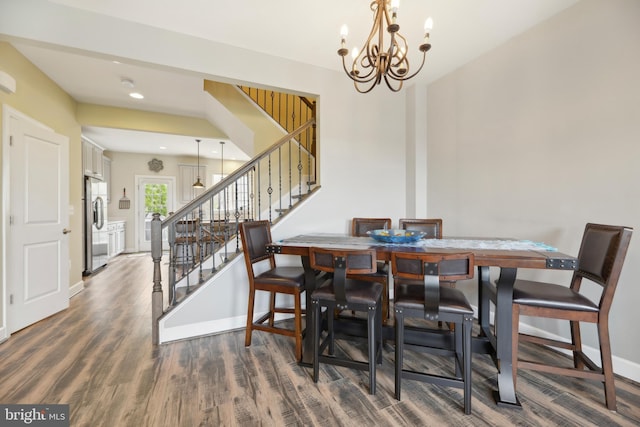 10723 Caledonia Meadow Dr, Manassas, VA 20112 - dining space featuring stairs, wood finished floors, a chandelier, baseboards, and recessed lighting