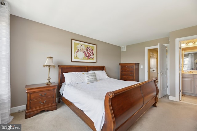 10723 Caledonia Meadow Dr, Manassas, VA 20112 - bedroom featuring light carpet, baseboards, and ensuite bathroom