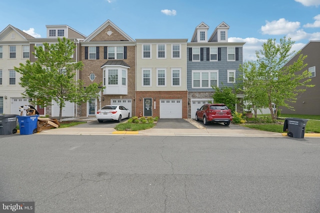 10723 Caledonia Meadow Dr, Manassas, VA 20112 - townhome / multi-family property with driveway, a garage, and brick siding