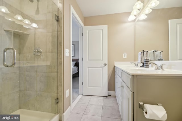 10723 Caledonia Meadow Dr, Manassas, VA 20112 - full bath with a tile shower, double vanity, tile patterned floors, baseboards, and a chandelier