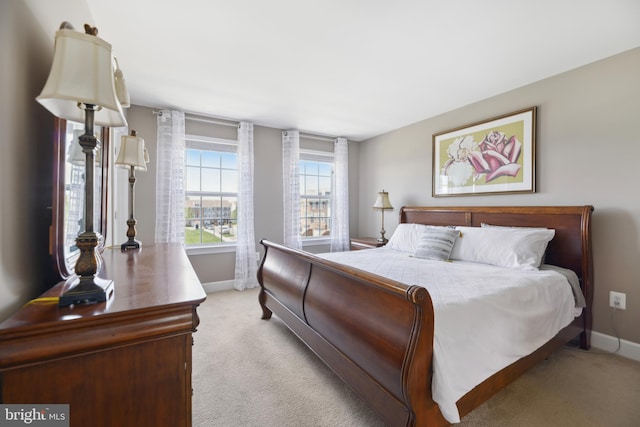 10723 Caledonia Meadow Dr, Manassas, VA 20112 - bedroom featuring baseboards and light carpet