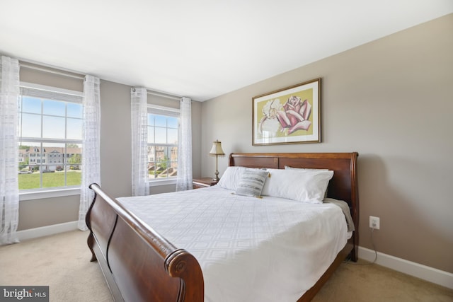 10723 Caledonia Meadow Dr, Manassas, VA 20112 - bedroom featuring light carpet and baseboards