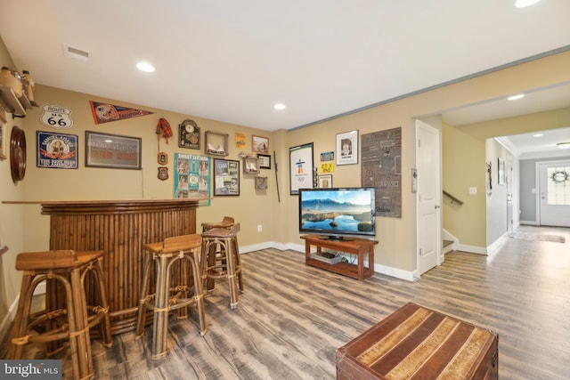 10723 Caledonia Meadow Dr, Manassas, VA 20112 - indoor dry bar featuring baseboards, wood finished floors, stairway, and recessed lighting