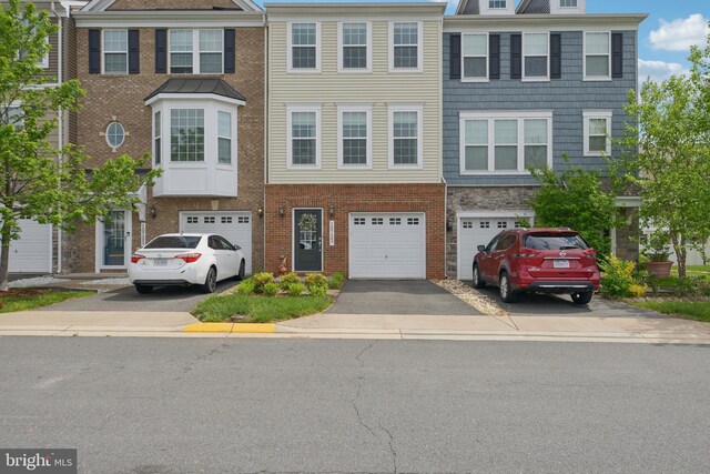 10723 Caledonia Meadow Dr, Manassas, VA 20112 - townhome / multi-family property with driveway and a garage