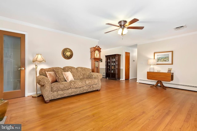 living room featuring ceiling fan, ornamental molding, light wood-style flooring, and visible vents
