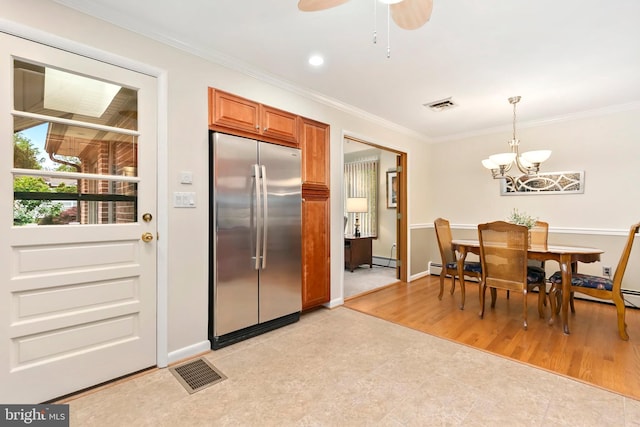 dining area with crown molding, baseboards, baseboard heating, and visible vents