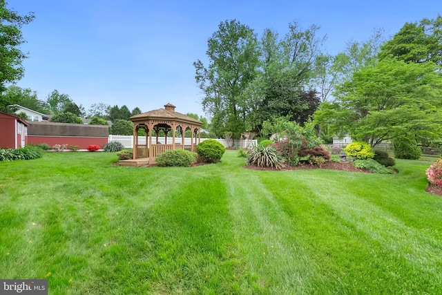 view of yard with a gazebo and fence