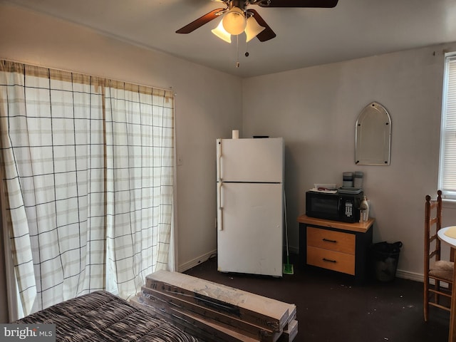 5737 N Park Ave, Philadelphia, PA 19141 - kitchen with freestanding refrigerator, black microwave, ceiling fan, and baseboards