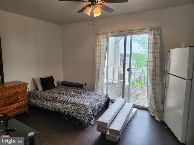 5737 N Park Ave, Philadelphia, PA 19141 - bedroom featuring freestanding refrigerator, access to outside, a ceiling fan, and concrete flooring