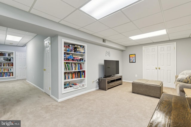 6724 Passageway Pl, Burke, VA 22015 - living area with a drop ceiling, carpet floors, built in features, and baseboards