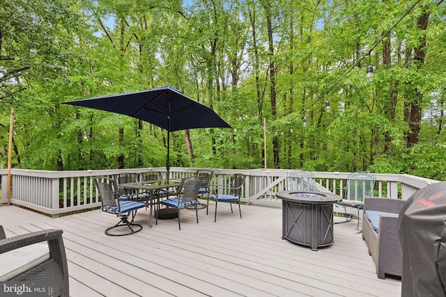 6724 Passageway Pl, Burke, VA 22015 - wooden deck with outdoor dining space, an outdoor fire pit, and a grill
