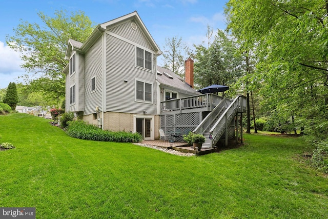 6724 Passageway Pl, Burke, VA 22015 - back of house with a wooden deck, a lawn, and stairs