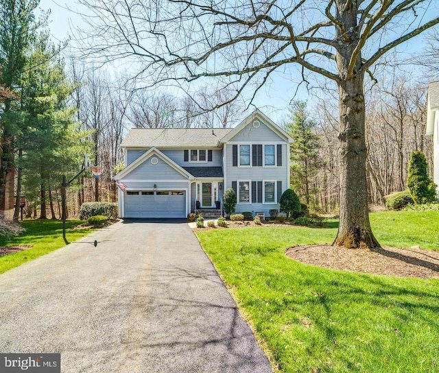 6724 Passageway Pl, Burke, VA 22015 - traditional-style home featuring driveway, a front yard, and an attached garage