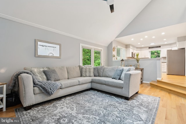 6724 Passageway Pl, Burke, VA 22015 - living area featuring healthy amount of natural light, light wood finished floors, recessed lighting, high vaulted ceiling, and a ceiling fan