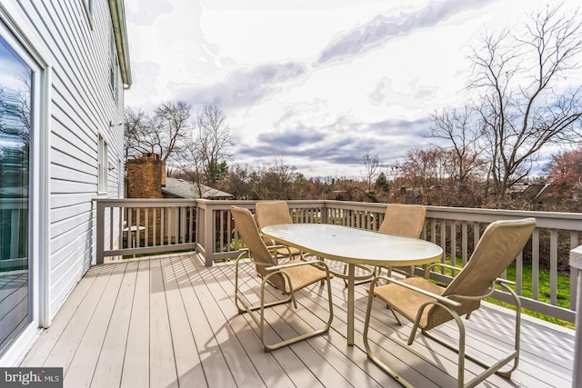 deck with outdoor dining area