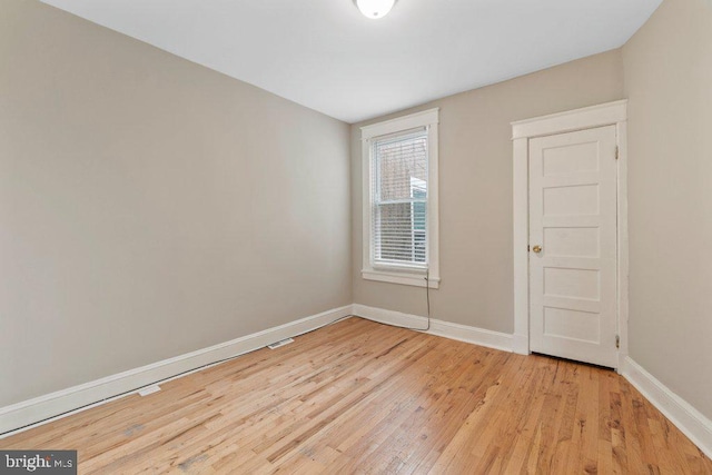 626 Denison St, Baltimore, MD 21229 - empty room with light wood-style floors and baseboards