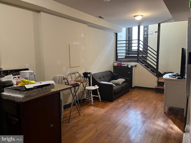 interior space featuring visible vents and hardwood / wood-style flooring