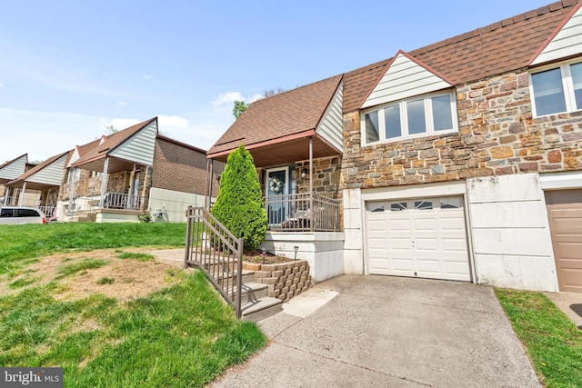 view of front facade with a porch, concrete driveway, an attached garage, a shingled roof, and stone siding