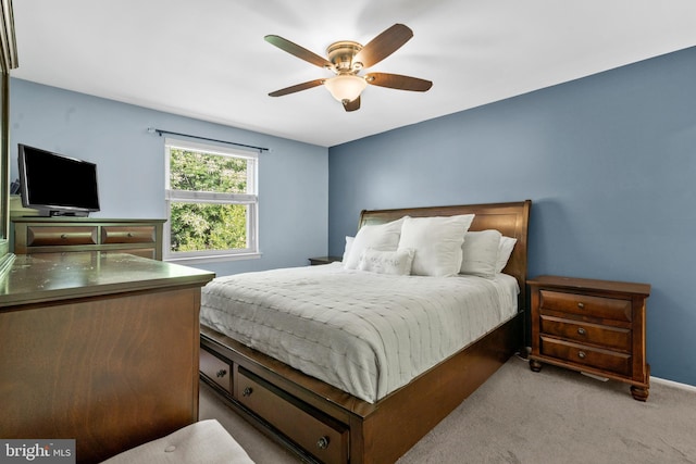 bedroom featuring baseboards, ceiling fan, and carpet flooring