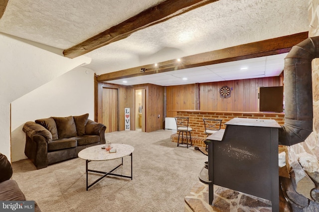 38 Bonniefield Cir, Gettysburg, PA 17325 - carpeted living room with wooden walls, beam ceiling, a dry bar, and a textured ceiling