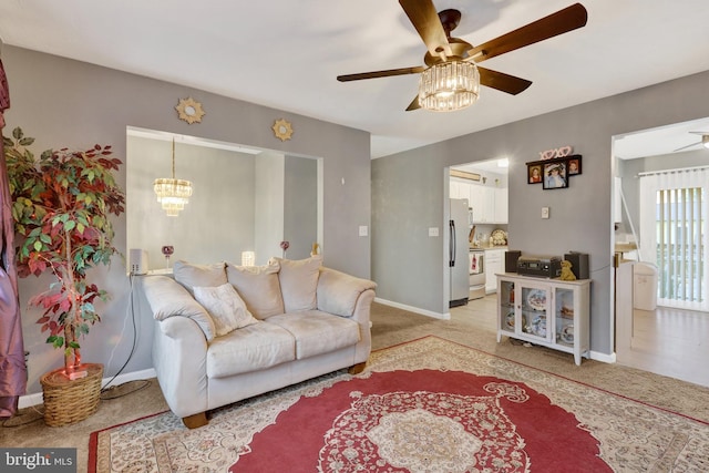 38 Bonniefield Cir, Gettysburg, PA 17325 - living room featuring a ceiling fan, light colored carpet, baseboards, and a chandelier
